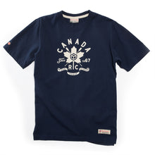 Load image into Gallery viewer, Navy blue t-shirt with white graphic Canada design on a white background.