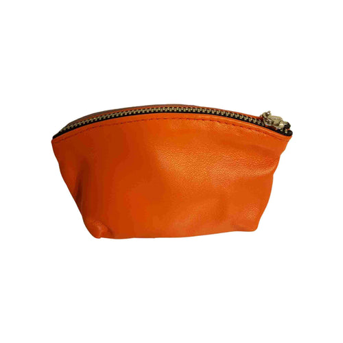 Orange coloured zippered leather wallet.