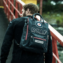Load image into Gallery viewer, Man with back pack on back.