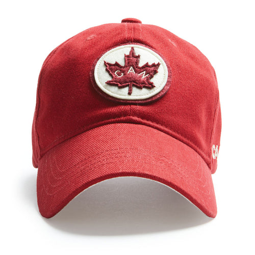 Red ball cap made of 100% brushed cotton twill.  Adjustable strap for fit and Canada logo. 