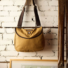 Load image into Gallery viewer, Shoulder bag hanging on wall.
