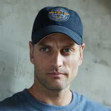 Load image into Gallery viewer, Gentleman wearing the dark blue De Havilland ball cap.
