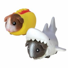 Load image into Gallery viewer, Two small animal figurines, one resembling a guinea pig in a yellow hot dog costume and the other a shark, on a white background.
