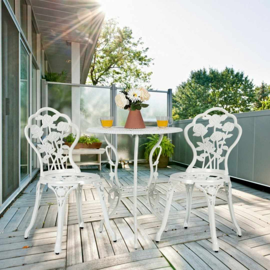 White durable metal Bistro set. Includes round table and two chairs.