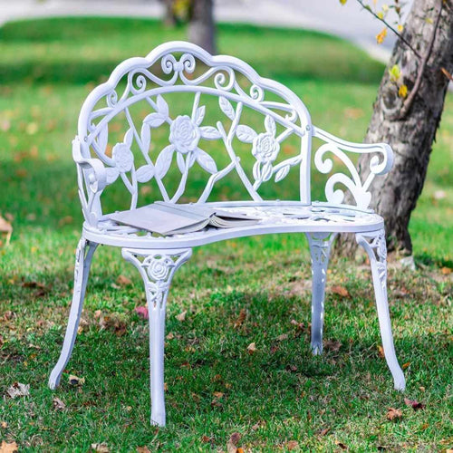 White rose garden bench. Enough room for two people to sit.