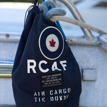 Load image into Gallery viewer, Navy drawstring bag with RCAF logo and text on a boat
