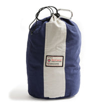 Load image into Gallery viewer, Blue and white drawstring bag with a visible brand label on a white background
