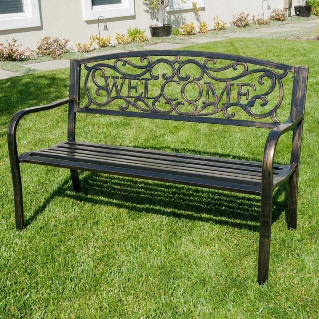 Bronze colour metal bench. Backing has a beautiful scroll work welcome.