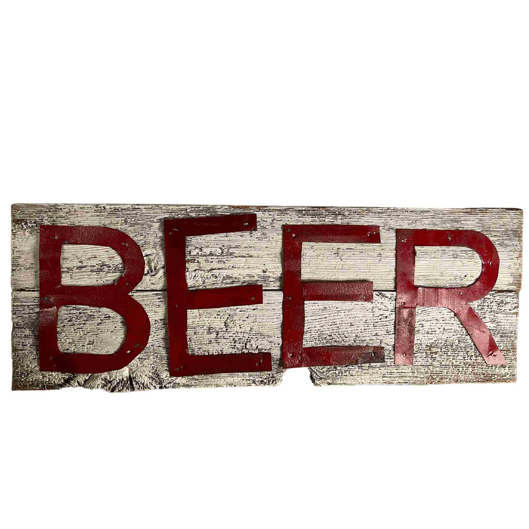 A sign for beer made from barn board and tin. Made in Kincardine Ontario.