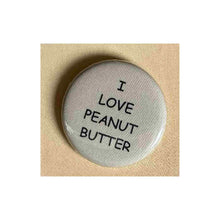 Load image into Gallery viewer, Pin on 1 1/4&quot; button with &quot; I love peanut butter&quot;.
