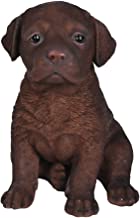Statue of resin chocolate Lab puppy. Six inches tall.