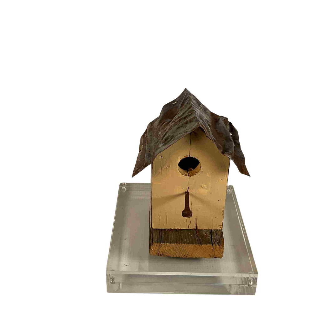 Small yellow decorative bird house.