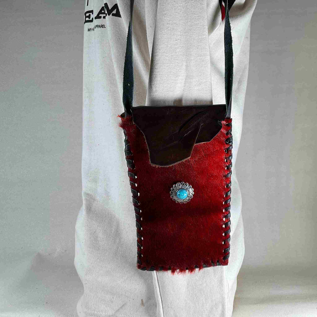 Shoulder bag hand stitched and made out of seal skin.