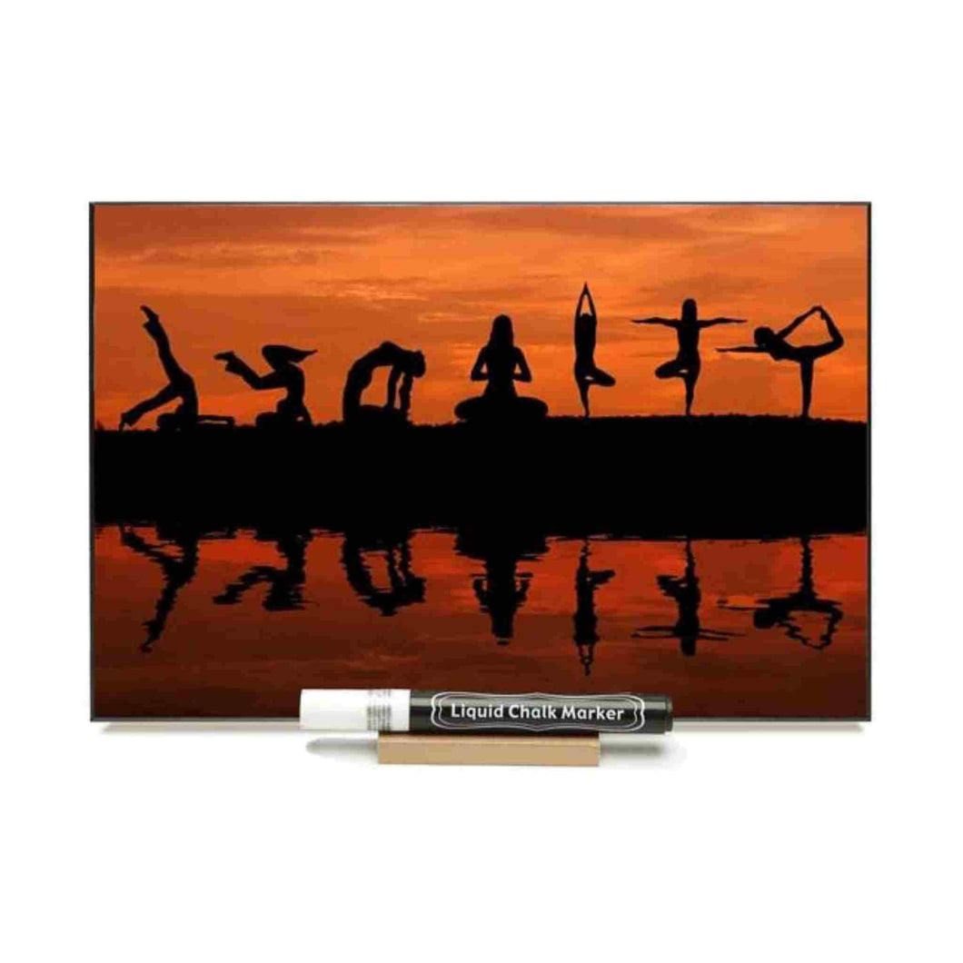Photo chalkboard with photo of various yoga poses in the sunset.