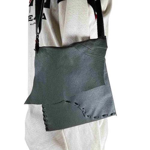 Hanging hand stitched grey leather bag.