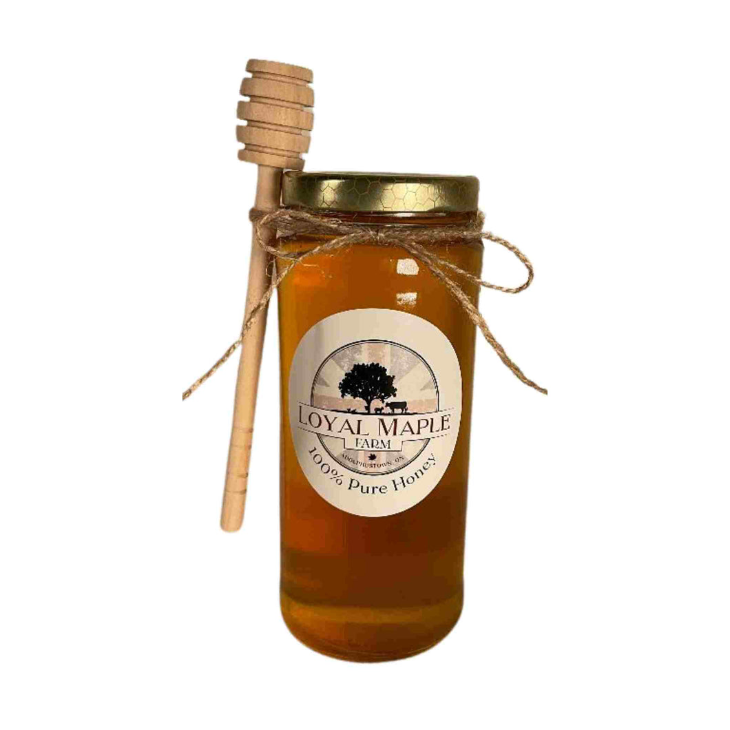 Local honey made in the same area as our store. Canadian unpasturized honey with wooden honey dipper.