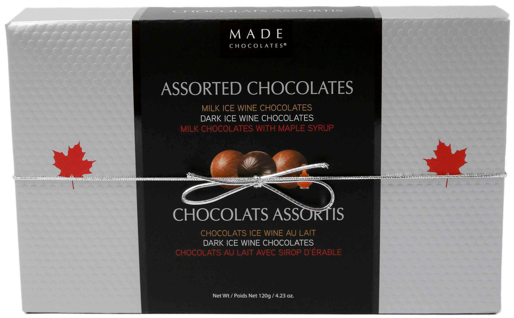 Canadian made box of chocolates made from 100% sustainably sourced cocoa. The selection includes dark chocolate, milk chocolate filled with ice wine or maple syrup.